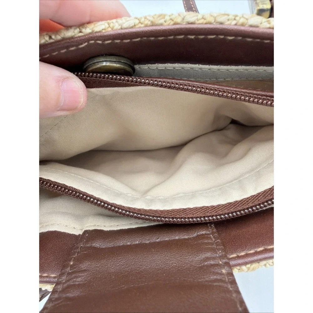 Rosetti straw tote handbag with brown faux leather trim‎ and top handles.